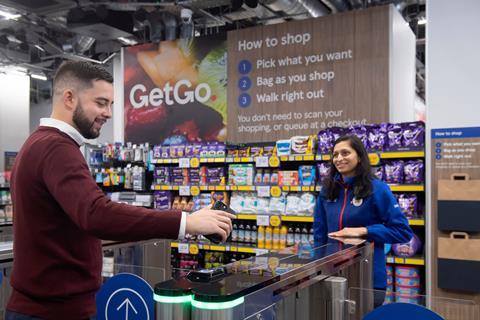 Customer and store worker at Tesco checkout-free store